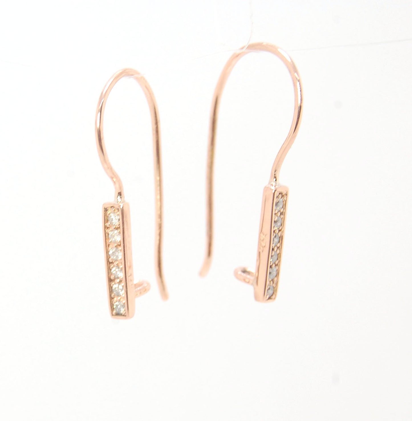 Short Tiny Diamond Earrings with french Hook and clasp - 14k Rose Gold These great little sparklers are subtle enough for every day as long as you don’t mind everyone noticing! They have 6 x 1.3mm diamonds in a single pave row. Earrings have french hook a