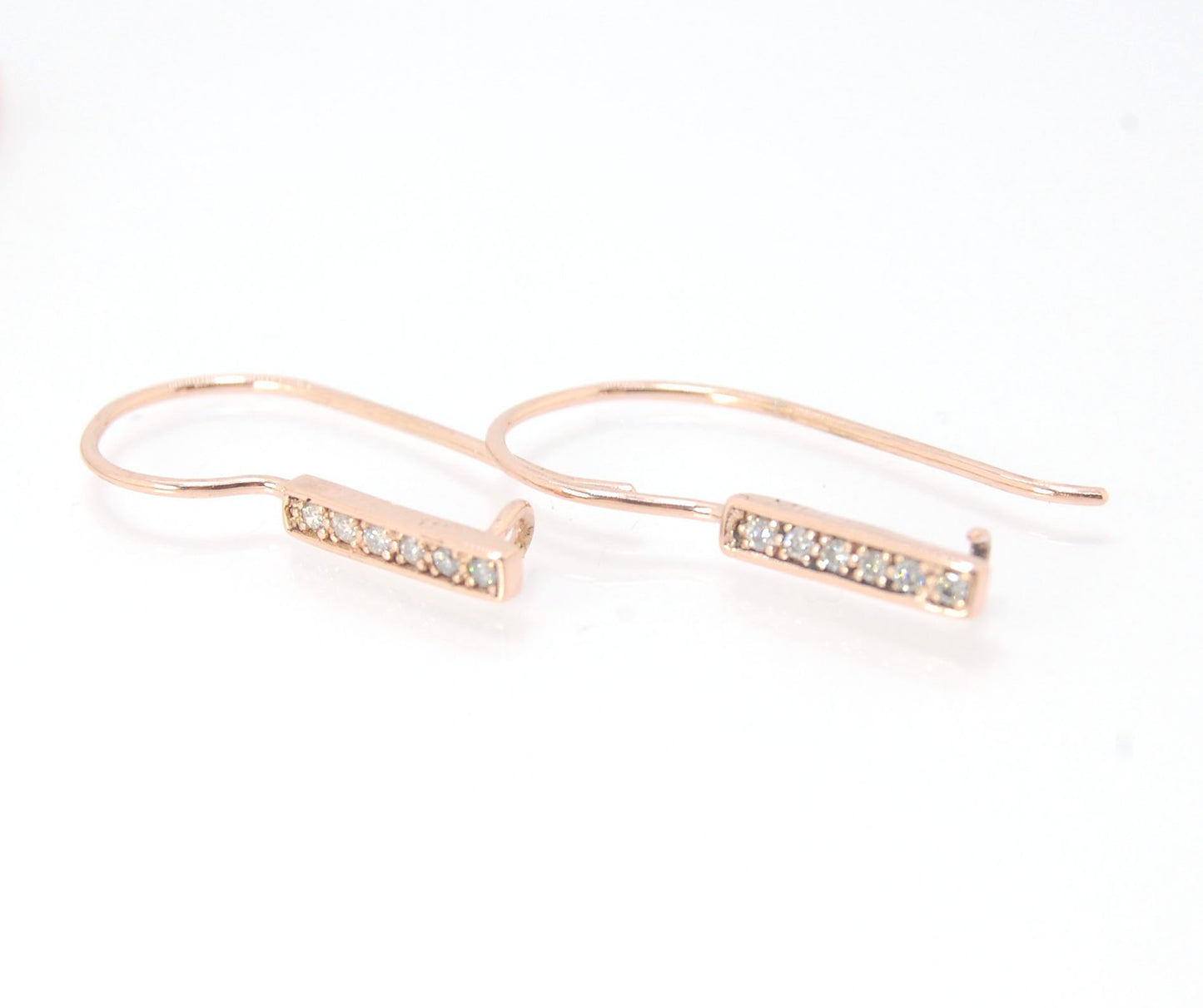 Short Tiny Diamond Earrings with french Hook and clasp - 14k Rose Gold These great little sparklers are subtle enough for every day as long as you don’t mind everyone noticing! They have 6 x 1.3mm diamonds in a single pave row. Earrings have french hook a