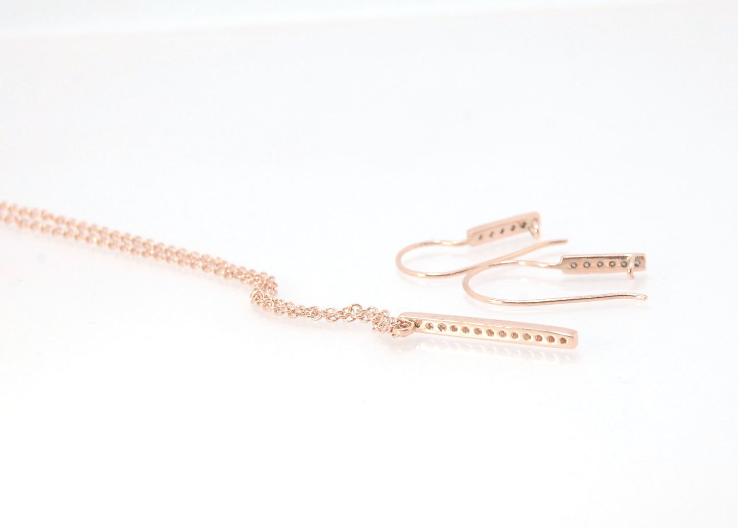 Short Tiny Diamond Earrings with french Hook and clasp - 14k Rose Gold These great little sparklers are subtle enough for every day as long as you don’t mind everyone noticing! They have 6 x 1.3mm diamonds in a single pave row. Earrings have french hook a