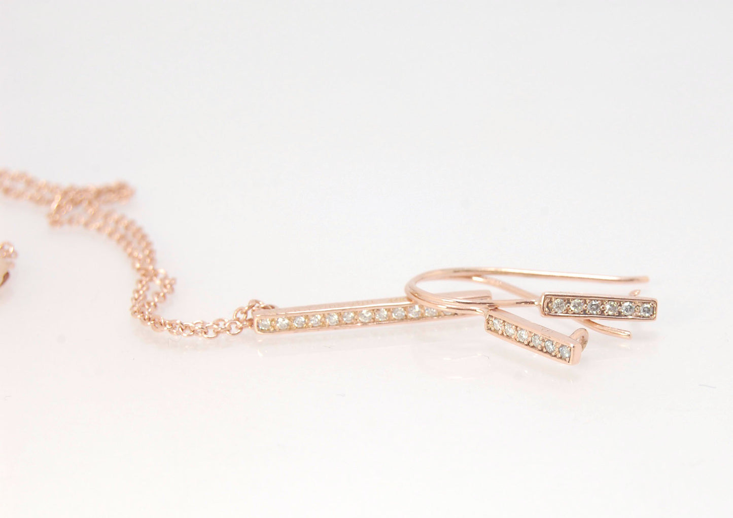 Short Tiny Diamond Earrings with french Hook and clasp - 14k Rose Gold These great little sparklers are subtle enough for every day as long as you don’t mind everyone noticing! They have 6 x 1.3mm diamonds in a single pave row. Earrings have french hook a