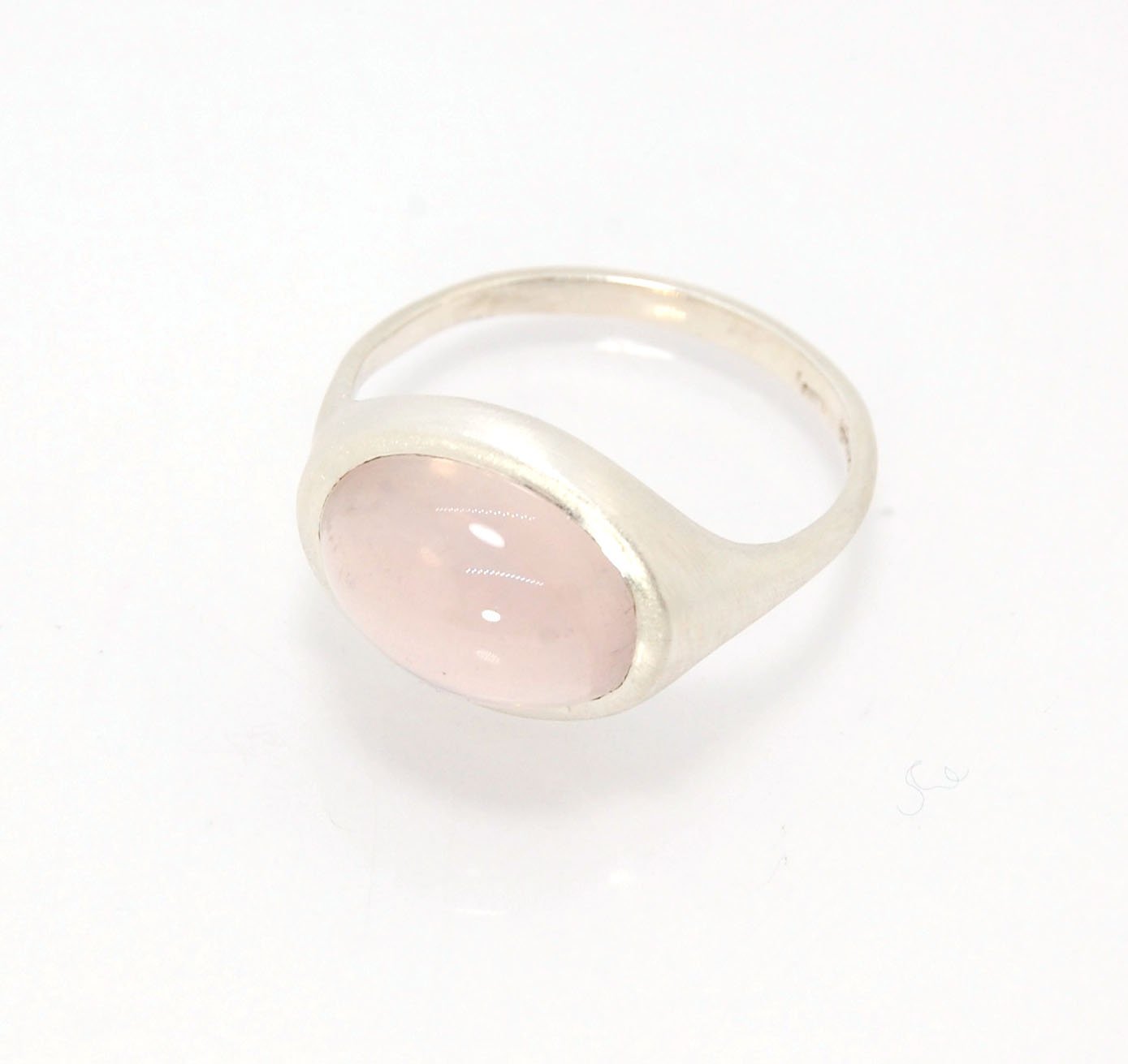 Rose Quartz Ring in Brushed Silver This is one of my first wax carved designs cast in sterling silver using a lost wax process. I start with a piece of wax and math and start carving until the ring is revealed! The back of the rIng is fully open so the ro