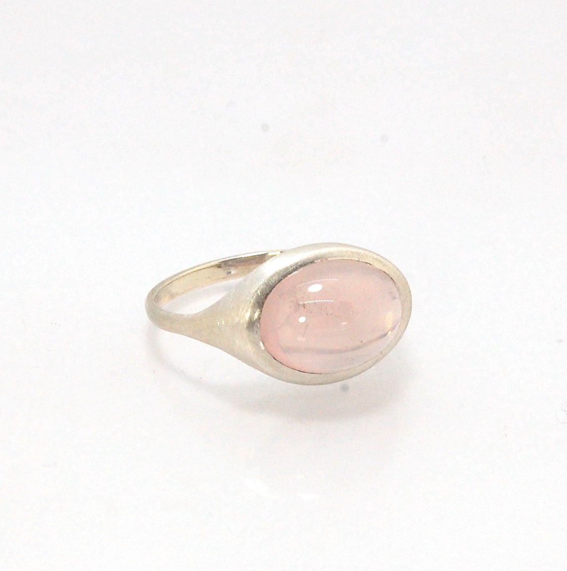 Rose Quartz Ring in Brushed Silver This is one of my first wax carved designs cast in sterling silver using a lost wax process. I start with a piece of wax and math and start carving until the ring is revealed! The back of the rIng is fully open so the ro