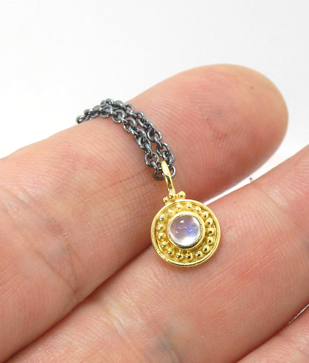 Tiny Round Rainbow Moonstone 18k gold Granulated Pendant This beautiful tiny round rainbow moonstone has so much luminance! A bezel-set small round rainbow moonstone is surrounded by larger 18k gold granules and can be ordered on the your chain of choice.