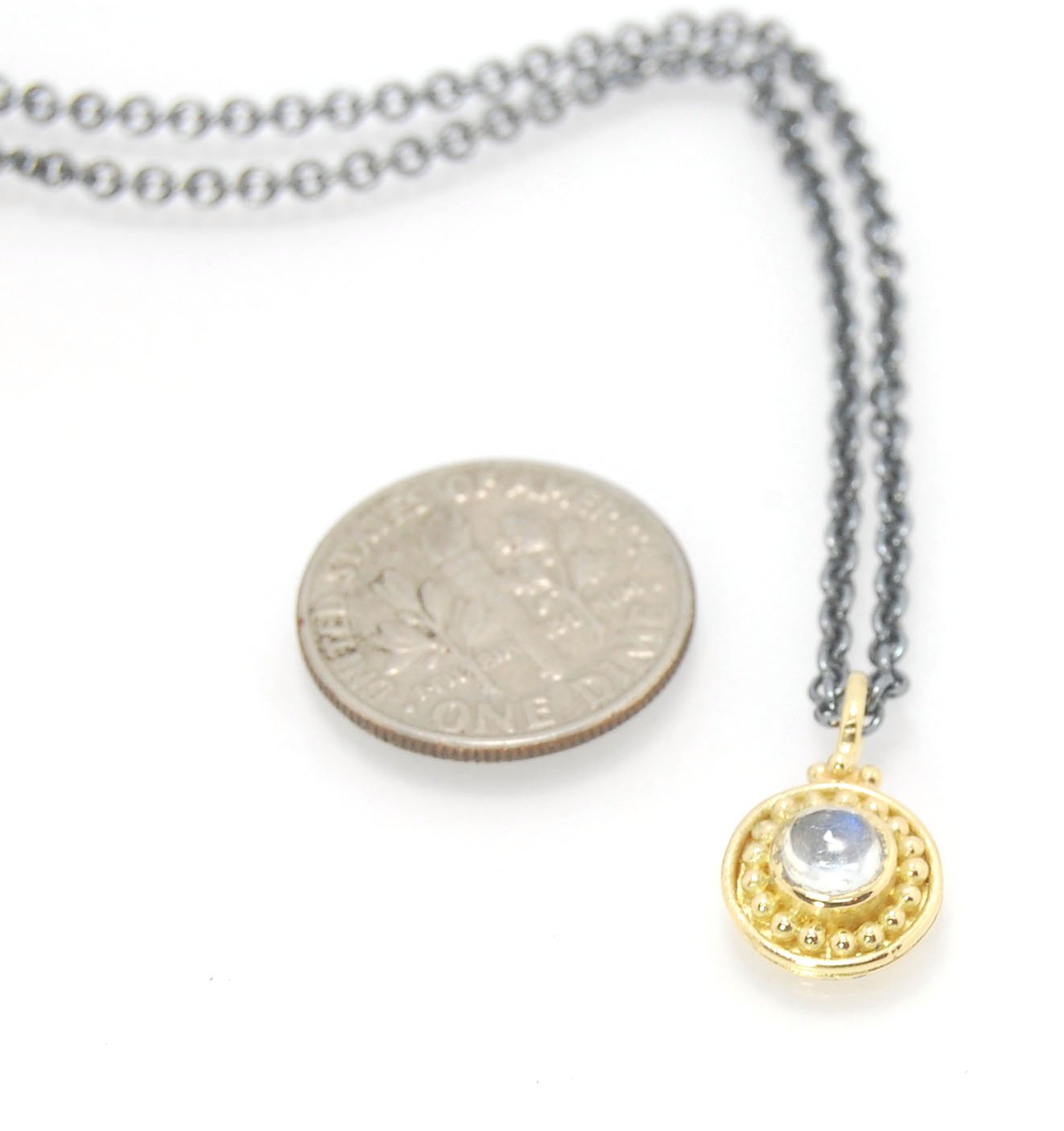 Tiny Round Rainbow Moonstone 18k gold Granulated Pendant This beautiful tiny round rainbow moonstone has so much luminance! A bezel-set small round rainbow moonstone is surrounded by larger 18k gold granules and can be ordered on the your chain of choice.