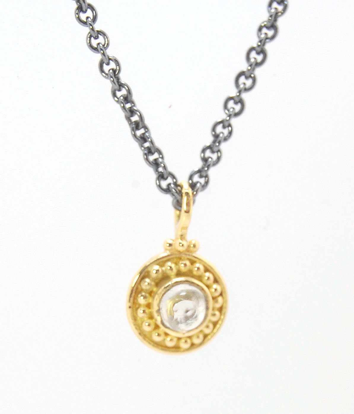 Tiny Round Rainbow Moonstone 18k gold Granulated Pendant This beautiful tiny round rainbow moonstone has so much luminance! A bezel-set small round rainbow moonstone is surrounded by larger 18k gold granules and can be ordered on the your chain of choice.