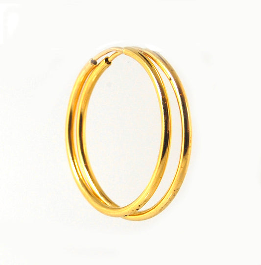 18k Rich Yellow Gold Solid Round Hoops These are great signature hoops. They may be the perfect Hoop! 27mm solid round hoops. Classic Shape and size. The ear wire terminates in a carved recess on the opposite side. Great weight and secure to wear. 27mm MA