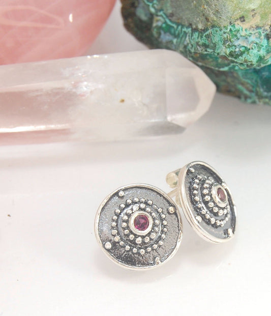 Post Shield Earrings in Sterling with Pink Garnet, Red Garnet, Blue Topaz, Peridot or Amethyst These terrific shield earrings are cast from a granulated original. and is cast using the lost wax process. You can choose which stone to set in your sterling s