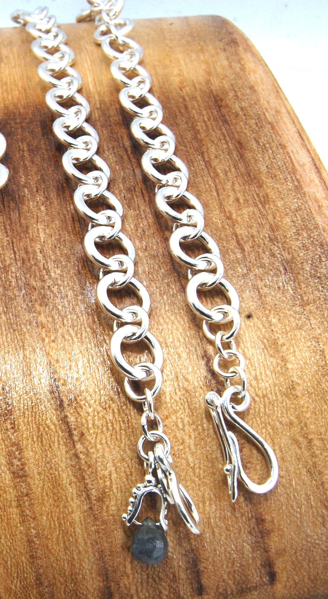 Shimmer Hammered Link Bracelet in Sterling Silver with Forged Safety clasp - in 4 size These are lovely silver bracelets, solid, with a hand-forged hook safety clasp.This heavy link bracelet is hand formed. Each link is run though the rolling mill to flat