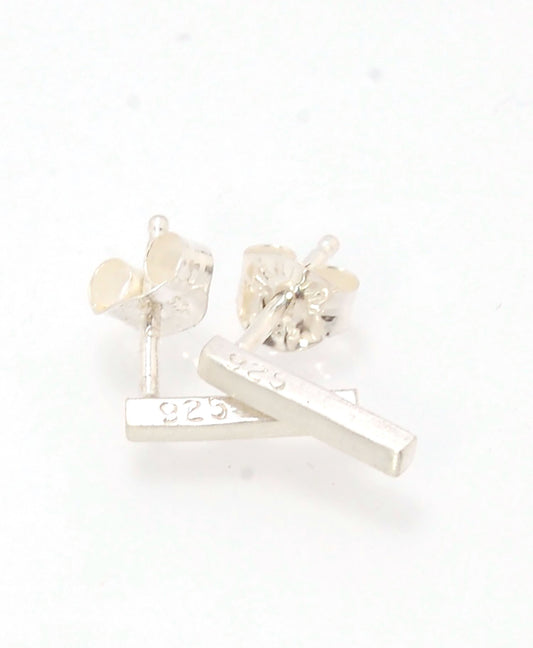 Silver Bar Post Earrings These are milled from sterling silver ingots here in my studio in my rolling mill. I then square the ingots with a hammer and add posts with my torch. These silver post earrings have a brushed finish.2mm x 9mmSterling SIlver Made