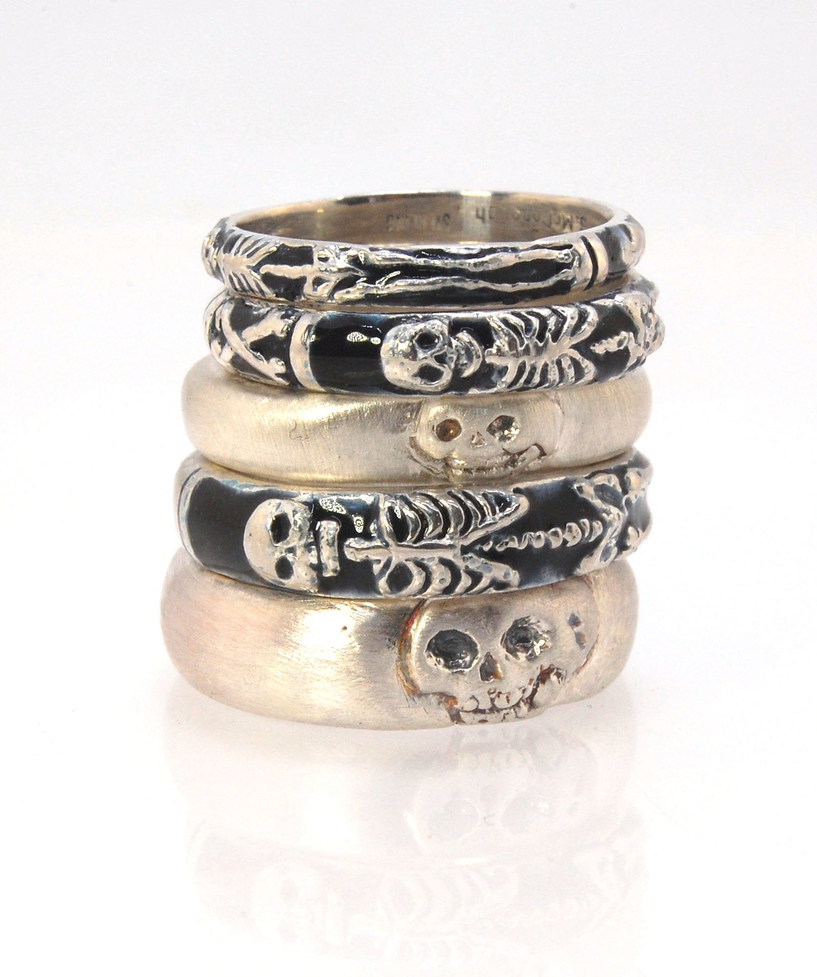 Memento Mori Skeleton Ring - Medium - 4mm - Enameled This is the middle width of my Memento Mori skeleton rings at 4mm wide. The Skeleton is flanked by crossed bones on one side and an hourglass on the other. Each ring in this collection is carved in wax