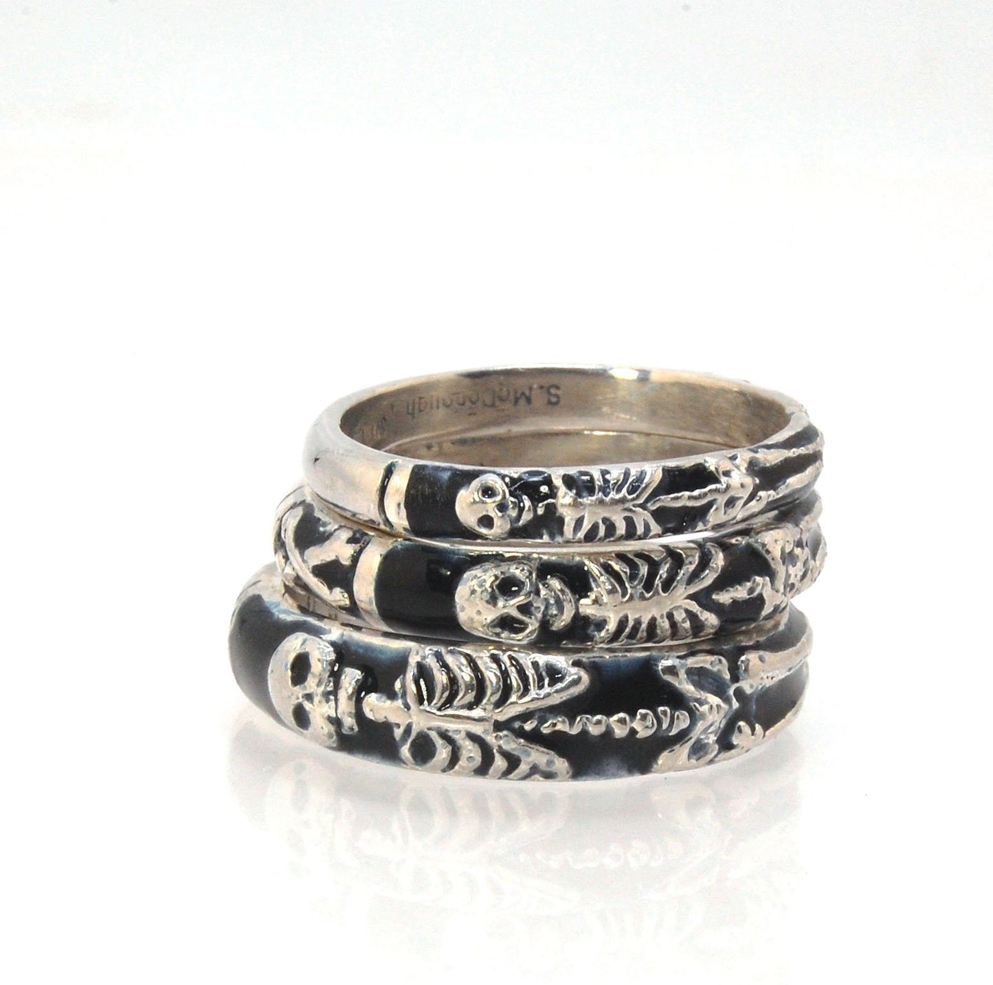 Memento Mori Skeleton Ring - Narrow -2.7mm -Enameled This is the most narrow of my Memento Mori rings at 3mm wide. The Skelton is flanked by intertwined hearts on one side. Each ring in this collection is carved in wax by hand and cast using the ancient l