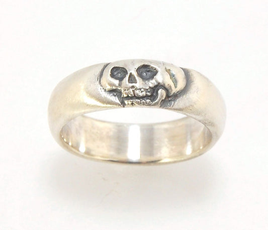 Memento Mori Skull Ring - Wide This is the widest of my Memento Mori skull rings at 7mm. Cast in sterling silver and given a brushed finish after oxidizing the recesses of the skull. Heavyweight, very comfortable.SterlingI made these Memento Mori rings fo