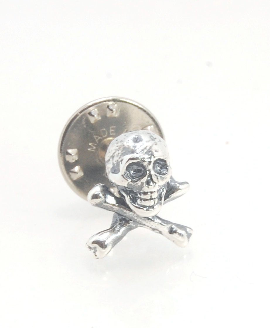 Skull & Bones Tie Tack Lapel Pin This solid sterling silver Skull & Bones tie tack label pin is wax carved by hand and cast using the ancient process of Lost Wax in sterling silver. I then made a mold, which I can inject with wax and make wax copies of th