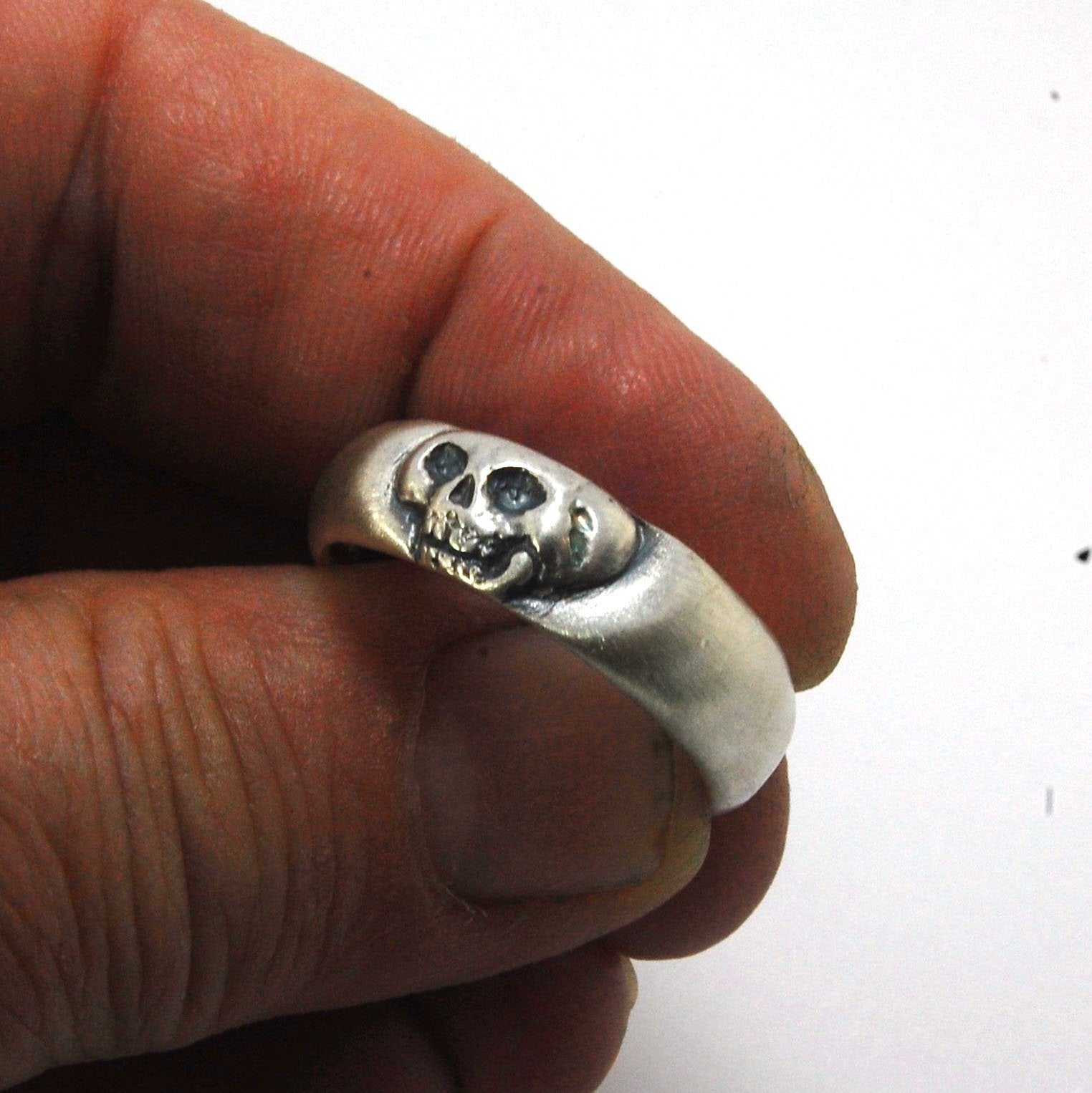 Memento Mori Skull Ring - Wide This is the widest of my Memento Mori skull rings at 7mm. Cast in sterling silver and given a brushed finish after oxidizing the recesses of the skull. Heavyweight, very comfortable.SterlingI made these Memento Mori rings fo