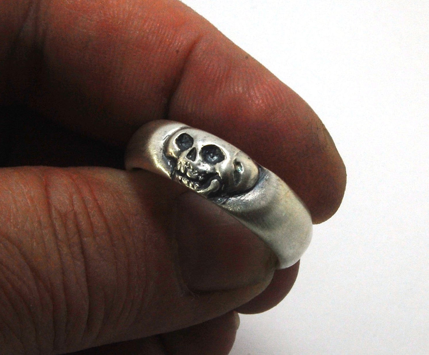 Memento Mori Skull Ring - Wide This is the widest of my Memento Mori skull rings at 7mm. Cast in sterling silver and given a brushed finish after oxidizing the recesses of the skull. Heavyweight, very comfortable.SterlingI made these Memento Mori rings fo