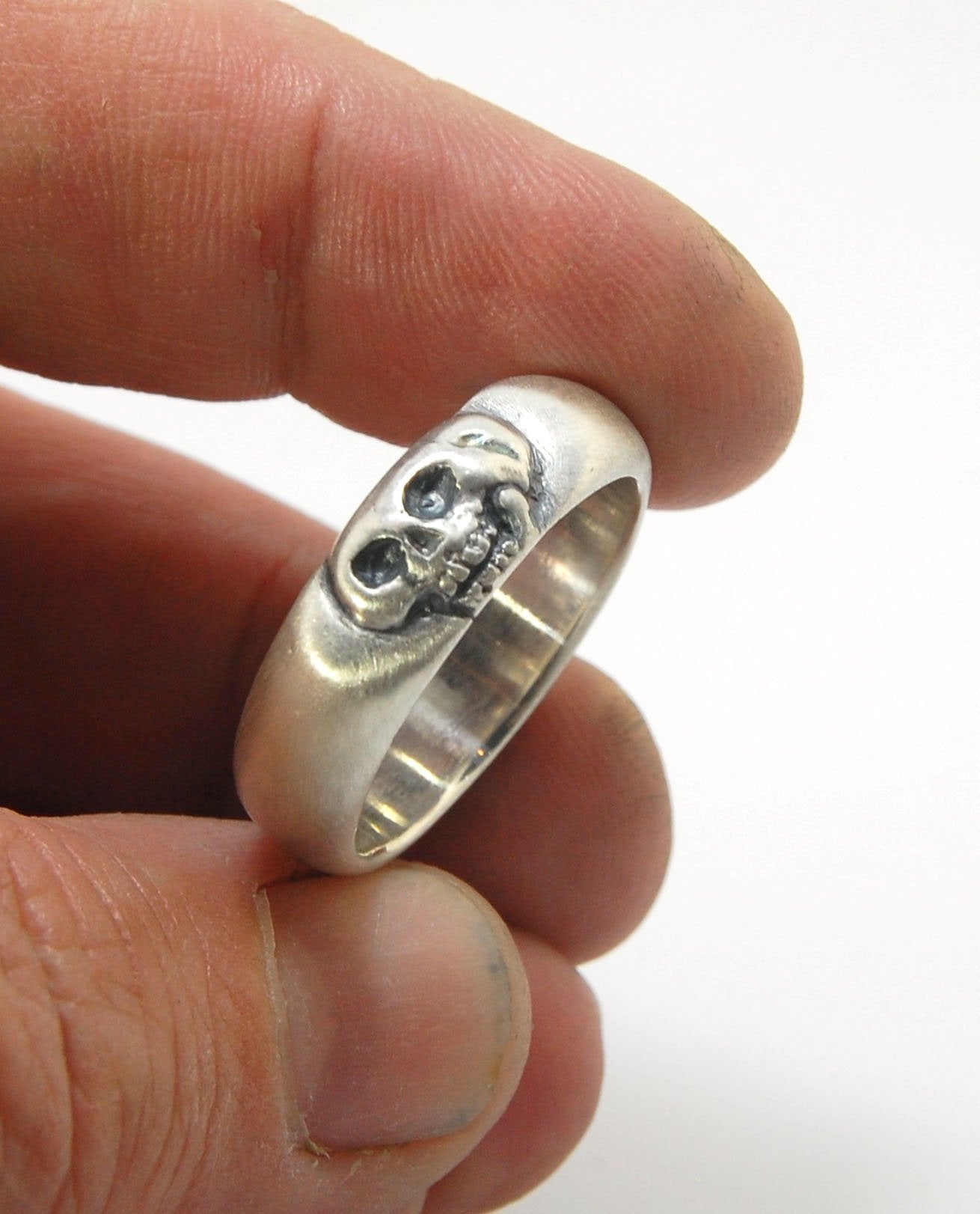 Memento Mori Skull Ring - Wide This is the widest of my Memento Mori skull rings at 7mm. Cast in sterling silver and given a brushed finish after oxidizing the recesses of the skull. Heavyweight, very comfortable.SterlingI made these Memento Mori rings fo