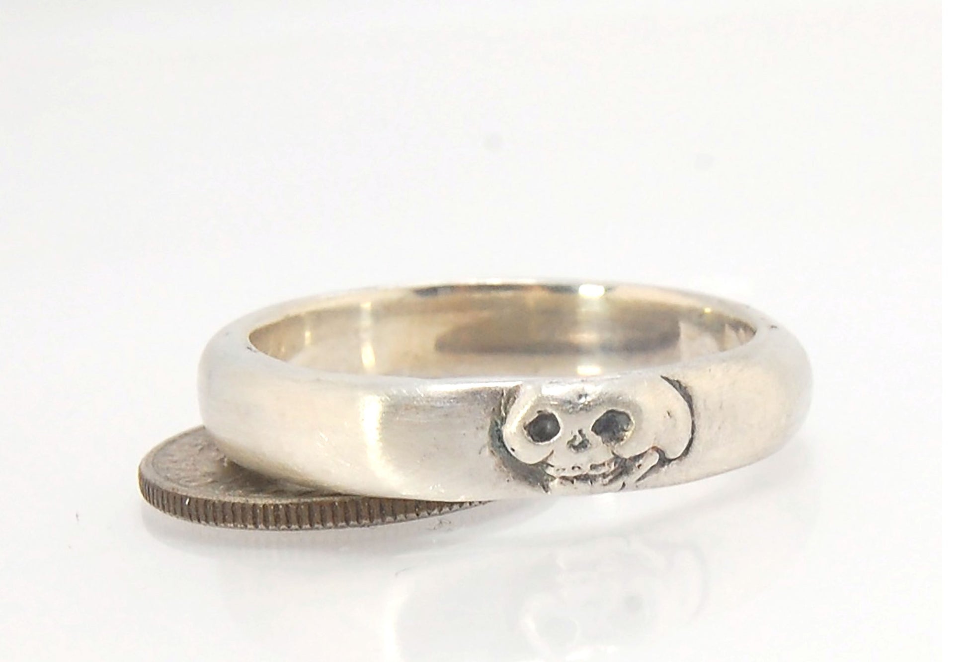 Memento Mori Skull Ring - Narrow This is narrow one of my two Memento Mori skull rings at 4mm. Cast in sterling silver and given a brushed finish after oxidizing the recesses of the skull. Heavyweight, very comfortable.SterlingI made these Memento Mori ri