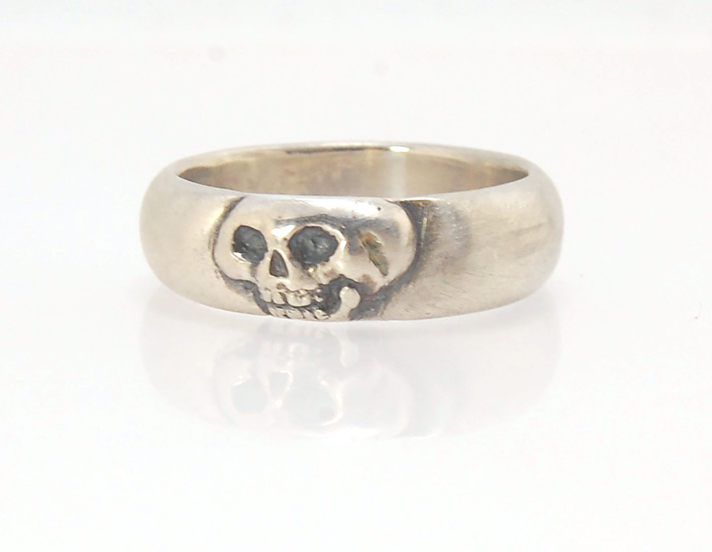 Memento Mori Skull Ring - Wide This is the widest of my Memento Mori skull rings at 7mm. Cast in sterling silver and given a brushed finish after oxidizing the recesses of the skull. Heavyweight, very comfortable.SterlingI made these Memento Mori rings fo