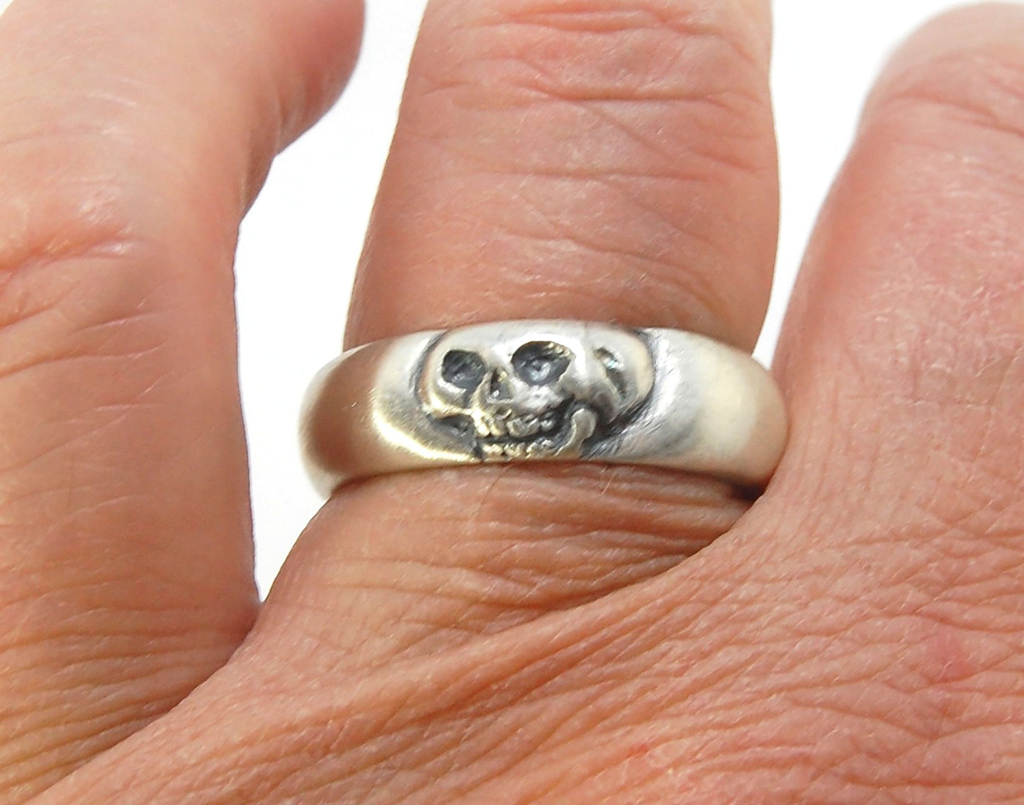 Memento Mori Skull Ring - Wide This is the widest of my Memento Mori skull rings at 7mm. Cast in sterling silver and given a brushed finish after oxidizing the recesses of the skull. Heavyweight, very comfortable.SterlingI made these Memento Mori rings fo