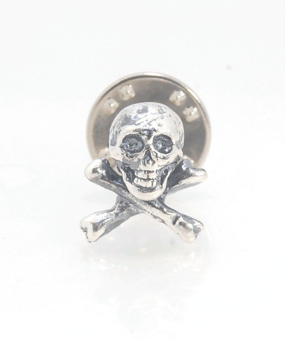 Skull & Bones Tie Tack Lapel Pin This solid sterling silver Skull & Bones tie tack label pin is wax carved by hand and cast using the ancient process of Lost Wax in sterling silver. I then made a mold, which I can inject with wax and make wax copies of th