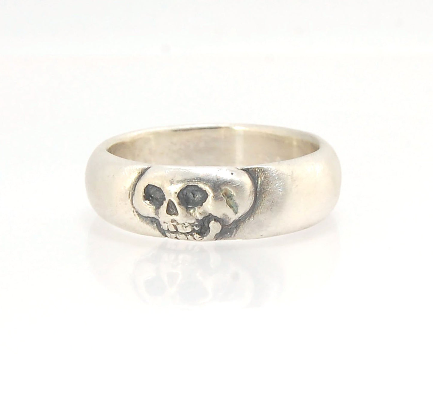 Memento Mori Skull Ring - Wide This is the widest of my Memento Mori skull rings at 7mm. Cast in sterling silver and given a brushed finish after oxidizing the recesses of the skull. Heavyweight, very comfortable.SterlingI made these Memento Mori rings fo