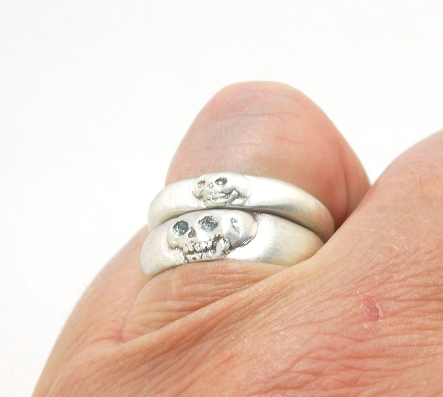 Memento Mori Skull Ring - Narrow This is narrow one of my two Memento Mori skull rings at 4mm. Cast in sterling silver and given a brushed finish after oxidizing the recesses of the skull. Heavyweight, very comfortable.SterlingI made these Memento Mori ri