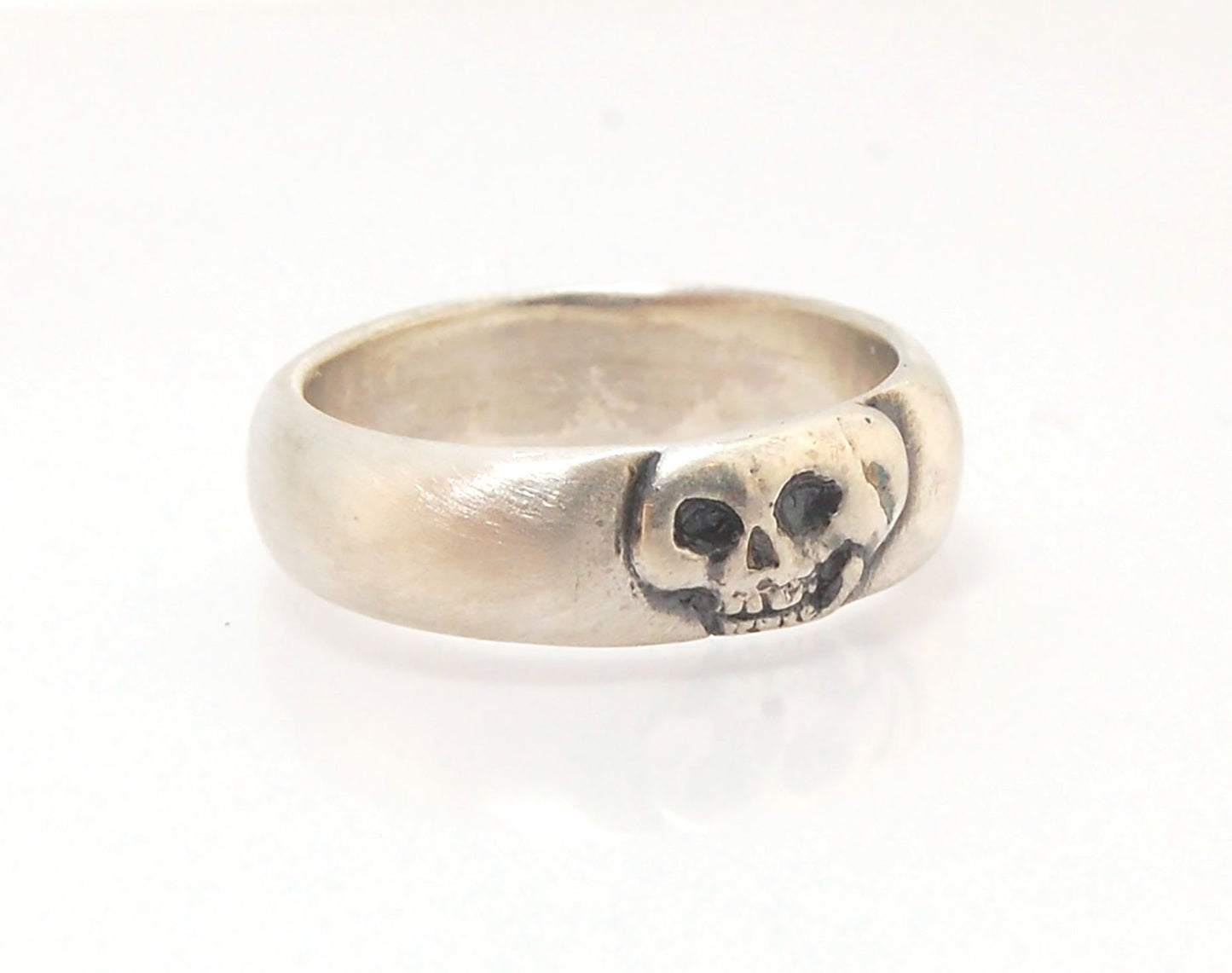 Memento Mori Skull Ring - Wide This is the widest of my Memento Mori skull rings at 7mm. Cast in sterling silver and given a brushed finish after oxidizing the recesses of the skull. Heavyweight, very comfortable.SterlingI made these Memento Mori rings fo