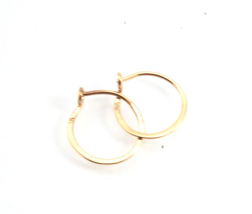 Hammered 14k Hoops - Small, Medium and Large These are exactly the same as my hammered sterling hoops, but they are made of solid 14k gold! They are super lightweight, classic wire hammered hoops you can sleep and live in. These delicate hoops are forged