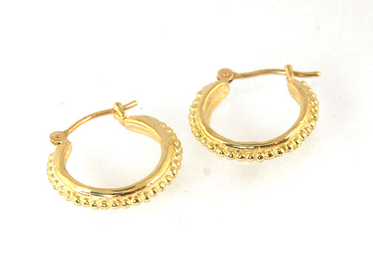 Etruscan hoops in 14k Gold - Small These 14k yellow gold hoops are cast in my studio (actually on the deck as casting needs good ventilation) from a granulated master for a limited edition series of hoops. I use fine silver for the original granulation, t