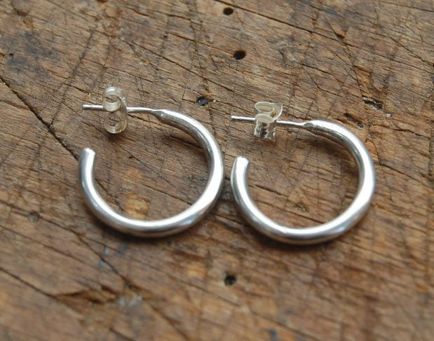 Solid Hoop Post Earrings - Medium - in Sterling These are a nice 3/4“ or 17mm wide post earrings. Made with a solid round rod of sterling silver and some solder posts, these simple and classy sterling silver posts have a nice light weight. Finished with a