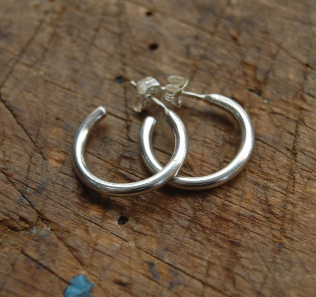 Solid Hoop Post Earrings - Medium - in Sterling These are a nice 3/4“ or 17mm wide post earrings. Made with a solid round rod of sterling silver and some solder posts, these simple and classy sterling silver posts have a nice light weight. Finished with a