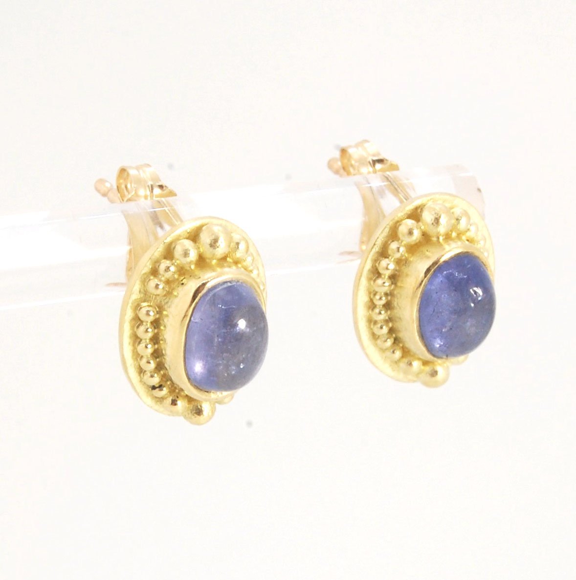 Tanzanite Oval Cabochon 18k Gold Granulated Post Earrings with 14k gold ear nuts I double love this color combination! These luminous, translucent tanzanites look terrific with the juicy 18k gold, especially with this finish. Tanzanite oval cabochons are