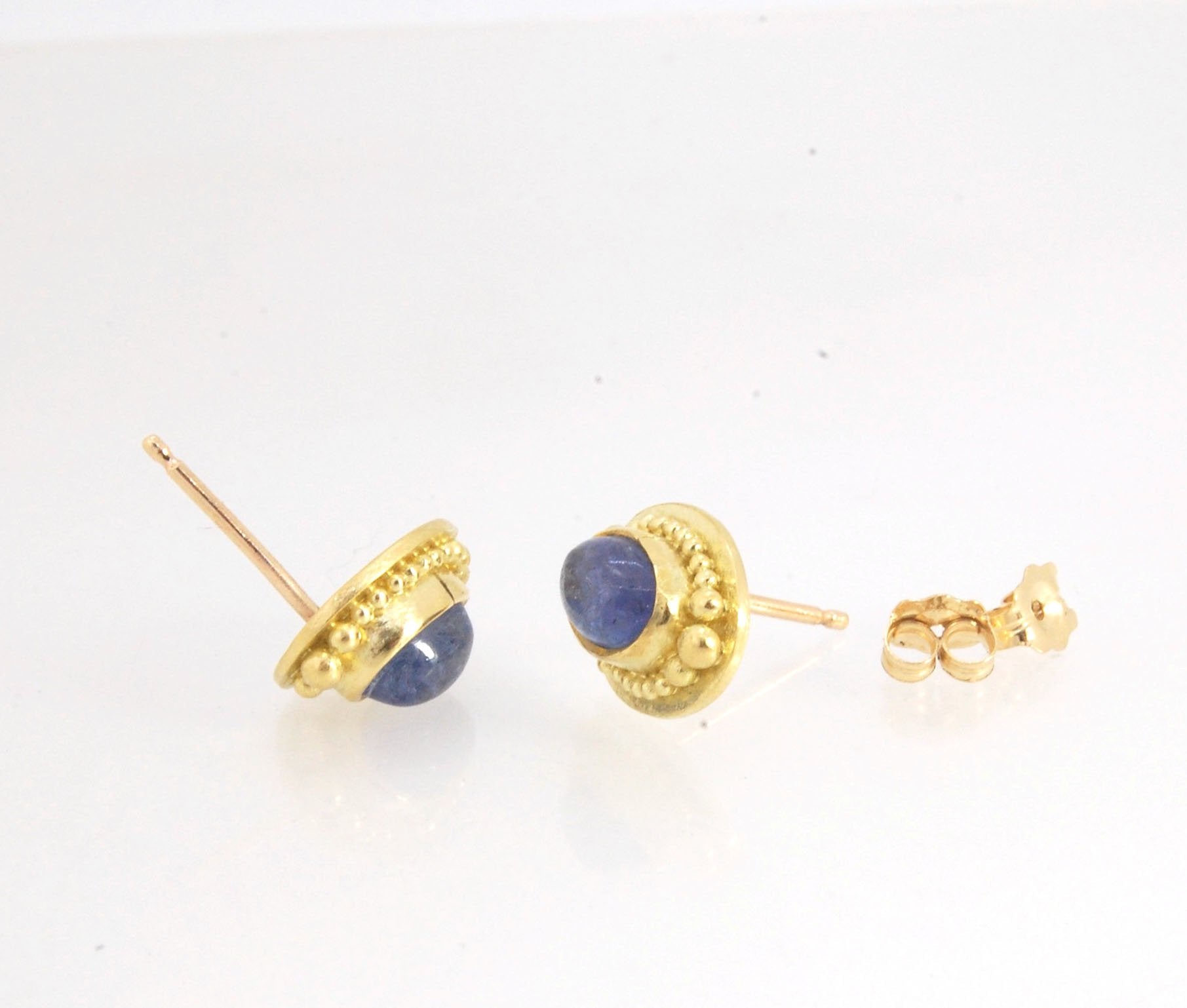 Tanzanite Oval Cabochon 18k Gold Granulated Post Earrings with 14k gold ear nuts I double love this color combination! These luminous, translucent tanzanites look terrific with the juicy 18k gold, especially with this finish. Tanzanite oval cabochons are