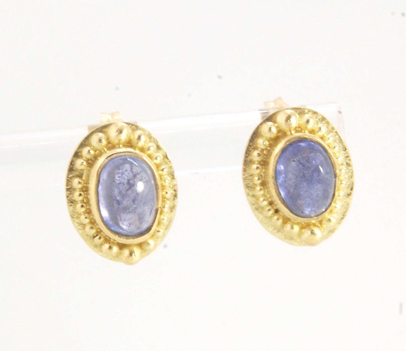 Tanzanite Oval Cabochon 18k Gold Granulated Post Earrings with 14k gold ear nuts I double love this color combination! These luminous, translucent tanzanites look terrific with the juicy 18k gold, especially with this finish. Tanzanite oval cabochons are