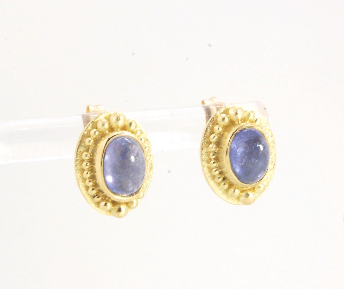 Tanzanite Oval Cabochon 18k Gold Granulated Post Earrings with 14k gold ear nuts I double love this color combination! These luminous, translucent tanzanites look terrific with the juicy 18k gold, especially with this finish. Tanzanite oval cabochons are