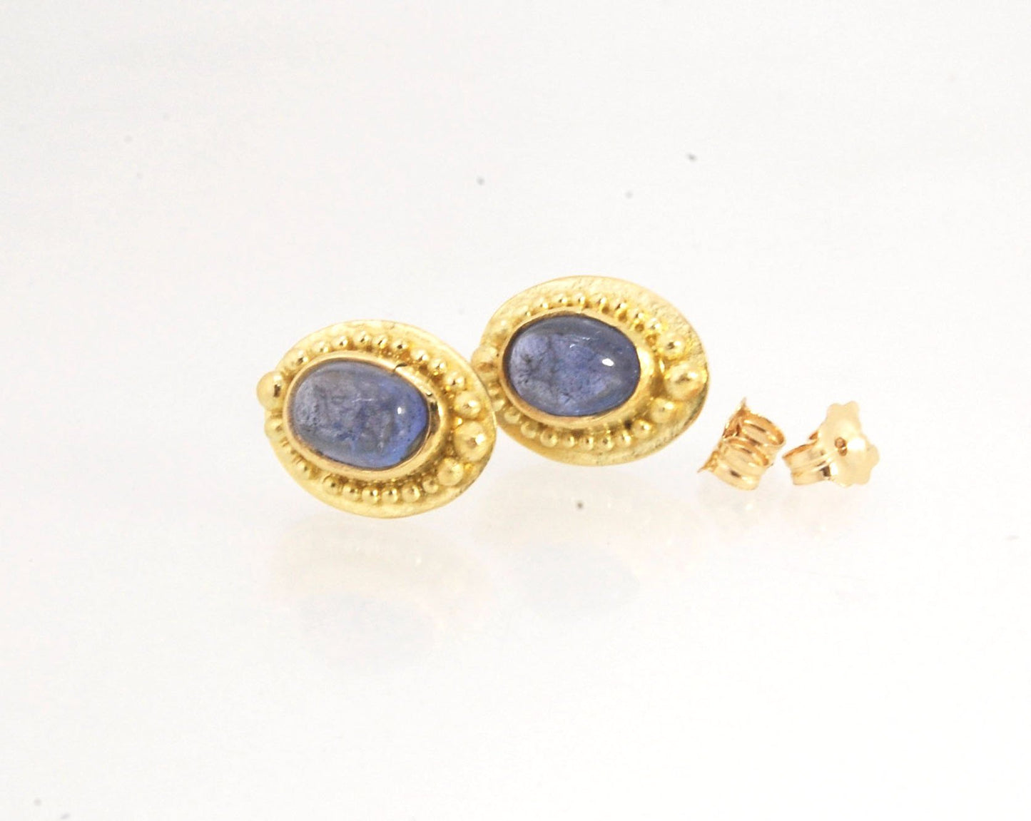 Tanzanite Oval Cabochon 18k Gold Granulated Post Earrings with 14k gold ear nuts I double love this color combination! These luminous, translucent tanzanites look terrific with the juicy 18k gold, especially with this finish. Tanzanite oval cabochons are