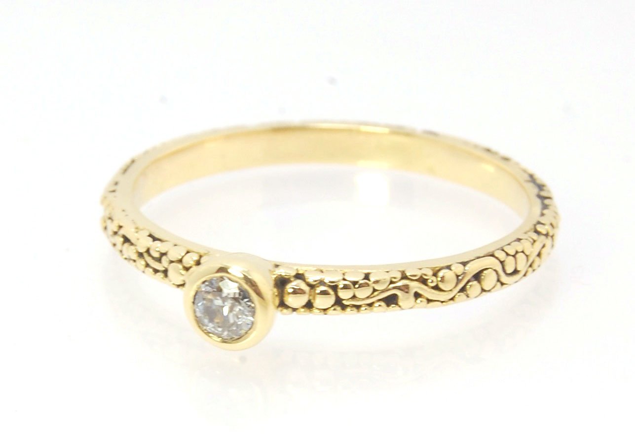 Twining Band Diamond Solitaire Ring in 18k Granulation This is a one-of-a-kind solitaire 18k ring. The twining band is 2mm wide and has a continuous pattern around made with an ancient and unique process of granulation in 18k gold alloyed in my studio. Th