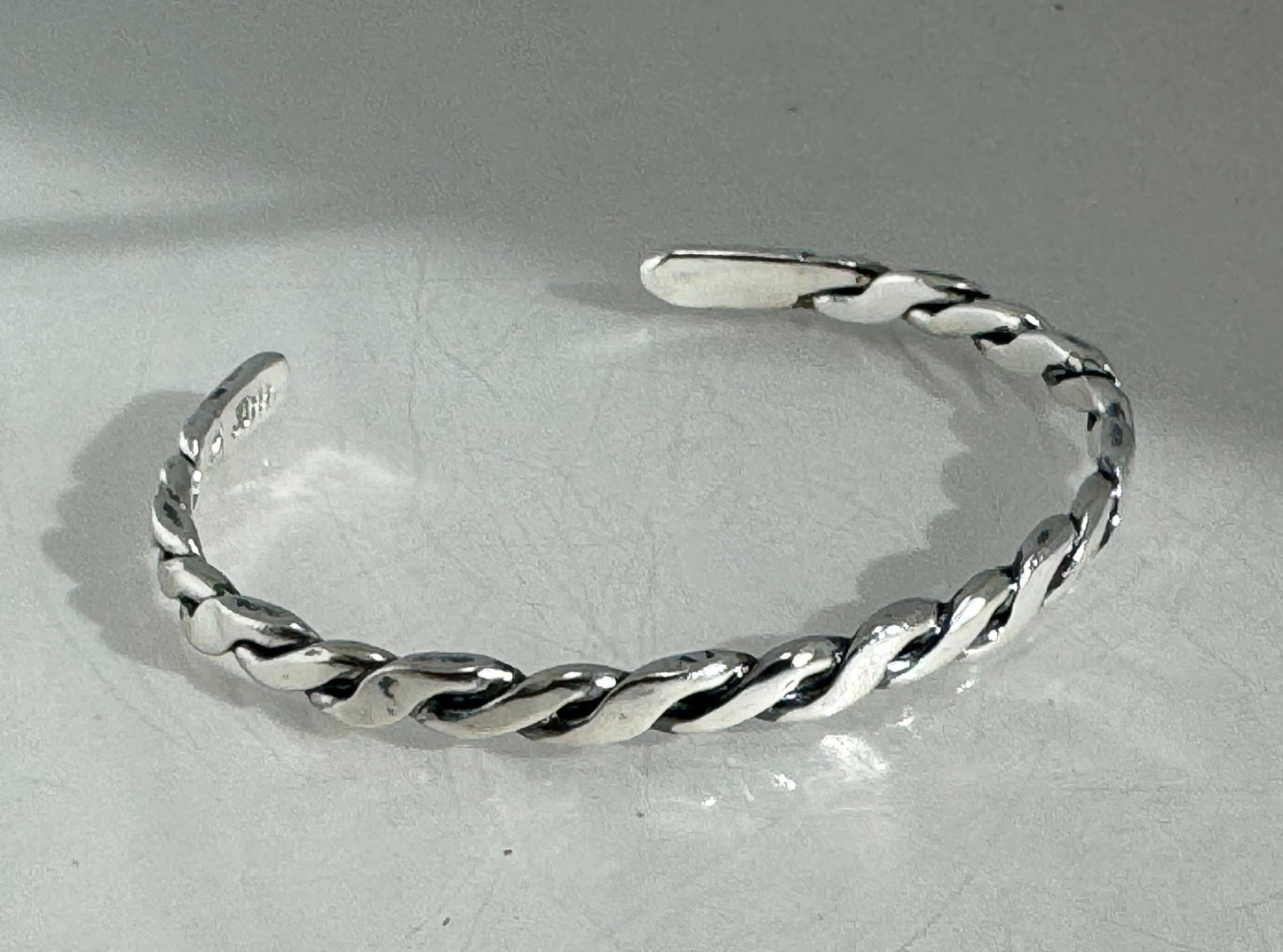 Twisted Cuff Bracelet - Sterling Silver This is a heavy, solid, twisted sterling silver cuff with a brushed finish. A staple of any collection! This sterling silver twisted cuff bracelet has a nice weight and feels good on. First I pour an ingot of sterli