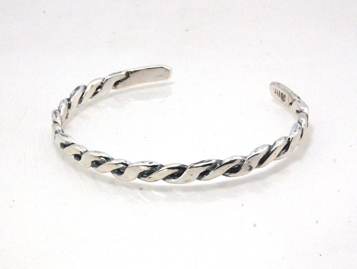 Twisted Cuff Bracelet - Sterling Silver This is a heavy, solid, twisted sterling silver cuff with a brushed finish. A staple of any collection! This sterling silver twisted cuff bracelet has a nice weight and feels good on. First I pour an ingot of sterli