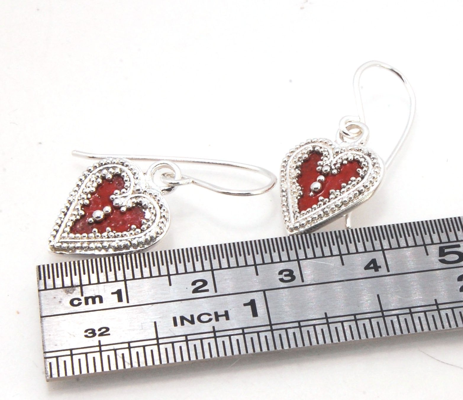 Victorian Hearts Dangle Earrings with Vitreous Enamel It’s VICTORIAN HEART charm dangle earrings in candy colors! Choose from : Red, Hollyhock, Azelea, or MauveThis is a lovely Victorian heart charm in sterling silver with vitreous enamel melted into the