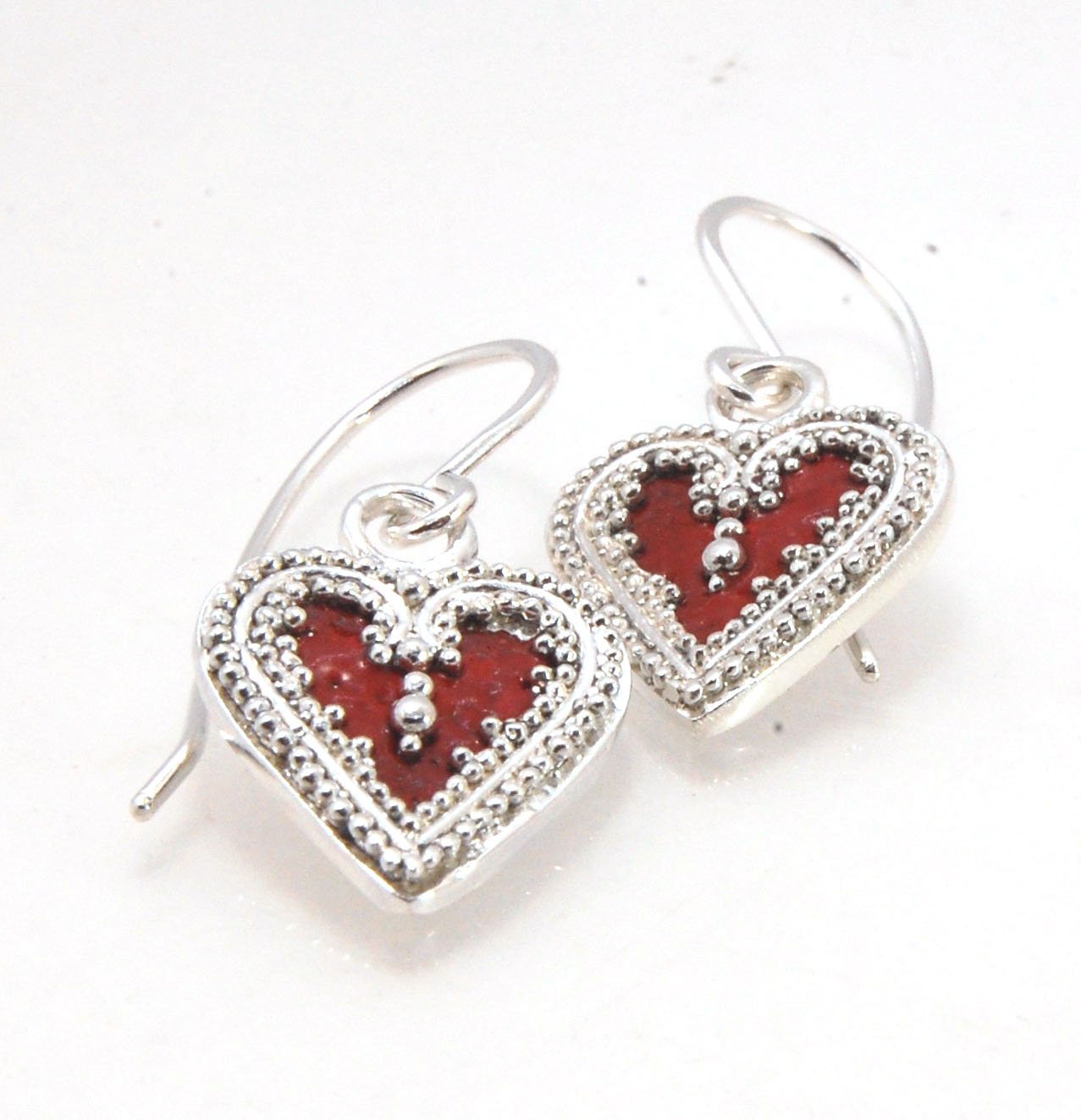 Victorian Hearts Dangle Earrings with Vitreous Enamel It’s VICTORIAN HEART charm dangle earrings in candy colors! Choose from : Red, Hollyhock, Azelea, or MauveThis is a lovely Victorian heart charm in sterling silver with vitreous enamel melted into the