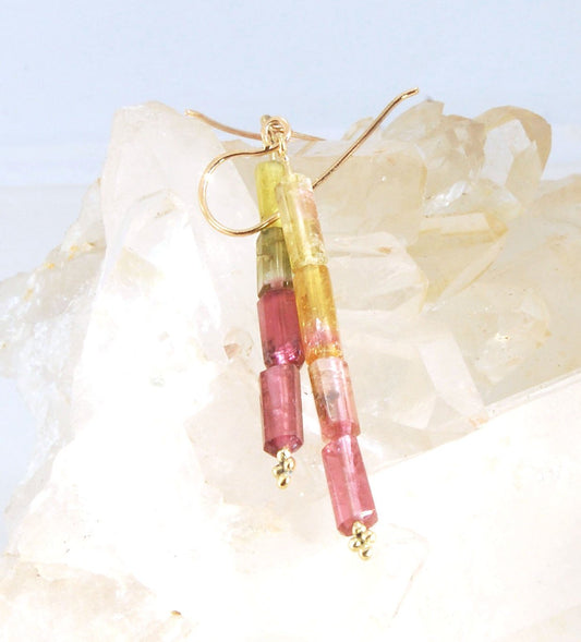 Watermelon Rind Tourmaline Dangle Earrings in 14k gold with french hooks Oh these colors! These Watermelon Rind Tourmaline Dangle Earrings in 14k gold with french hooks are made from faceted slices of natural tourmaline crystals on a 14 pin with 18k spher