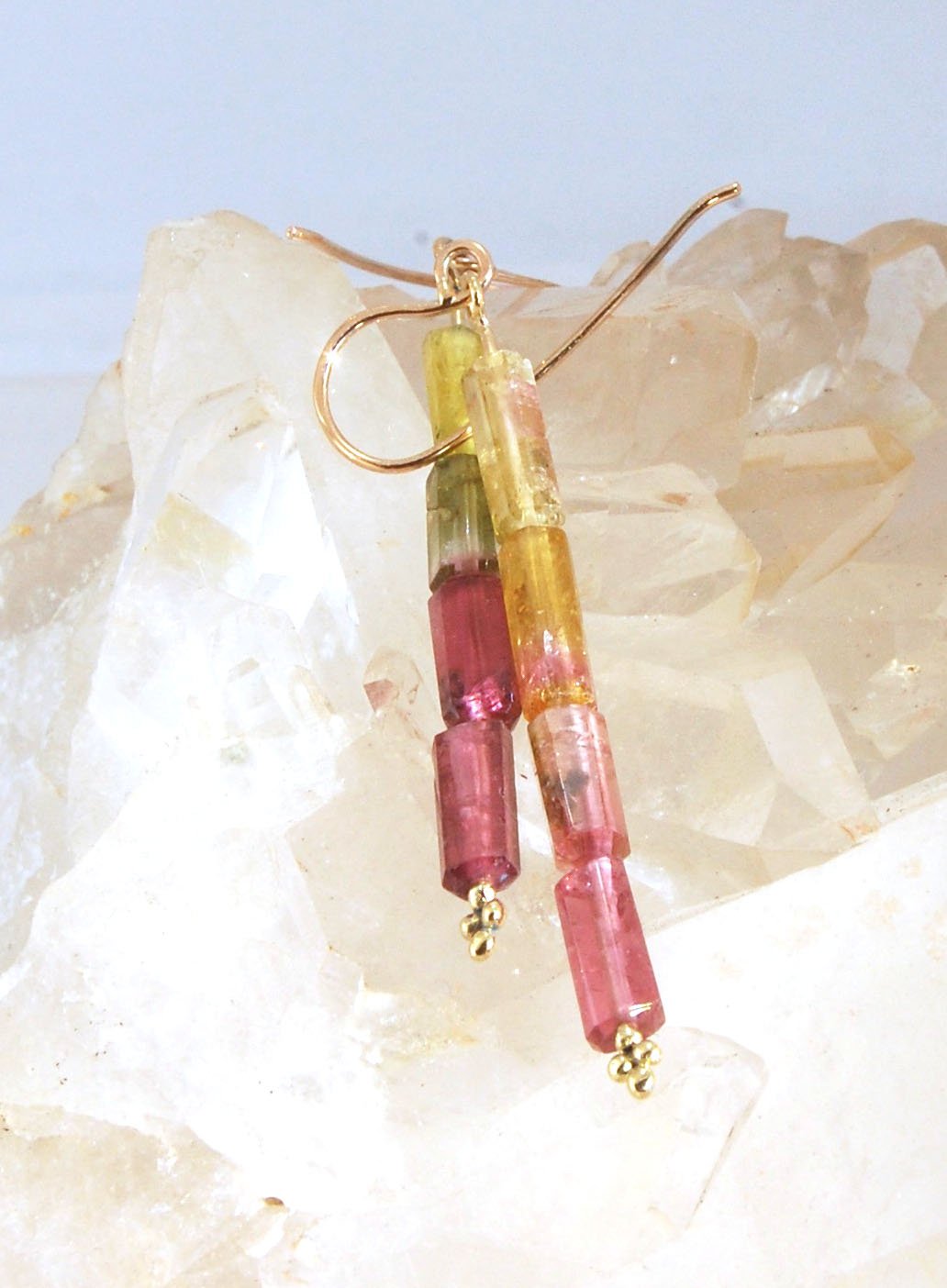 Watermelon Rind Tourmaline Dangle Earrings in 14k gold with french hooks Oh these colors! These Watermelon Rind Tourmaline Dangle Earrings in 14k gold with french hooks are made from faceted slices of natural tourmaline crystals on a 14 pin with 18k spher