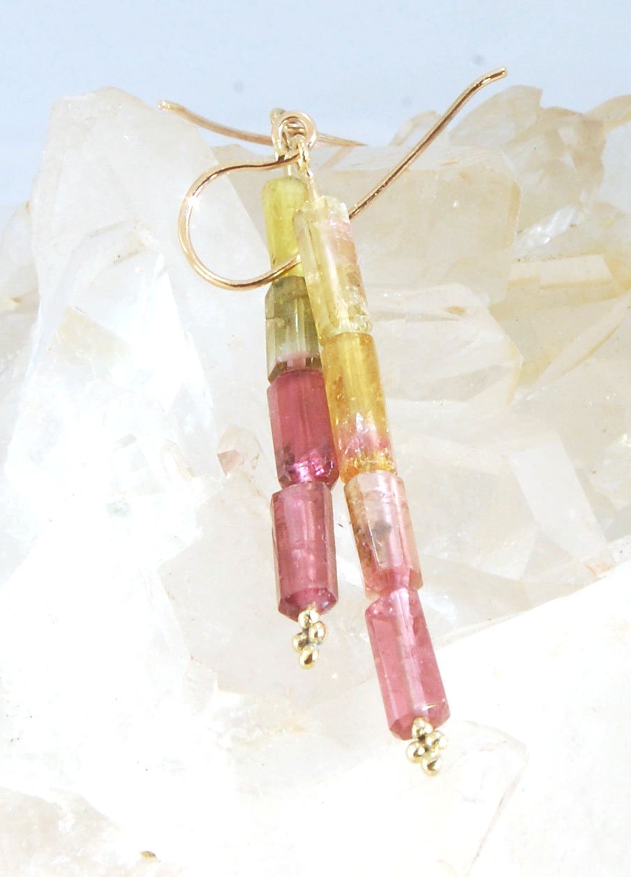 Watermelon Rind Tourmaline Dangle Earrings in 14k gold with french hooks Oh these colors! These Watermelon Rind Tourmaline Dangle Earrings in 14k gold with french hooks are made from faceted slices of natural tourmaline crystals on a 14 pin with 18k spher