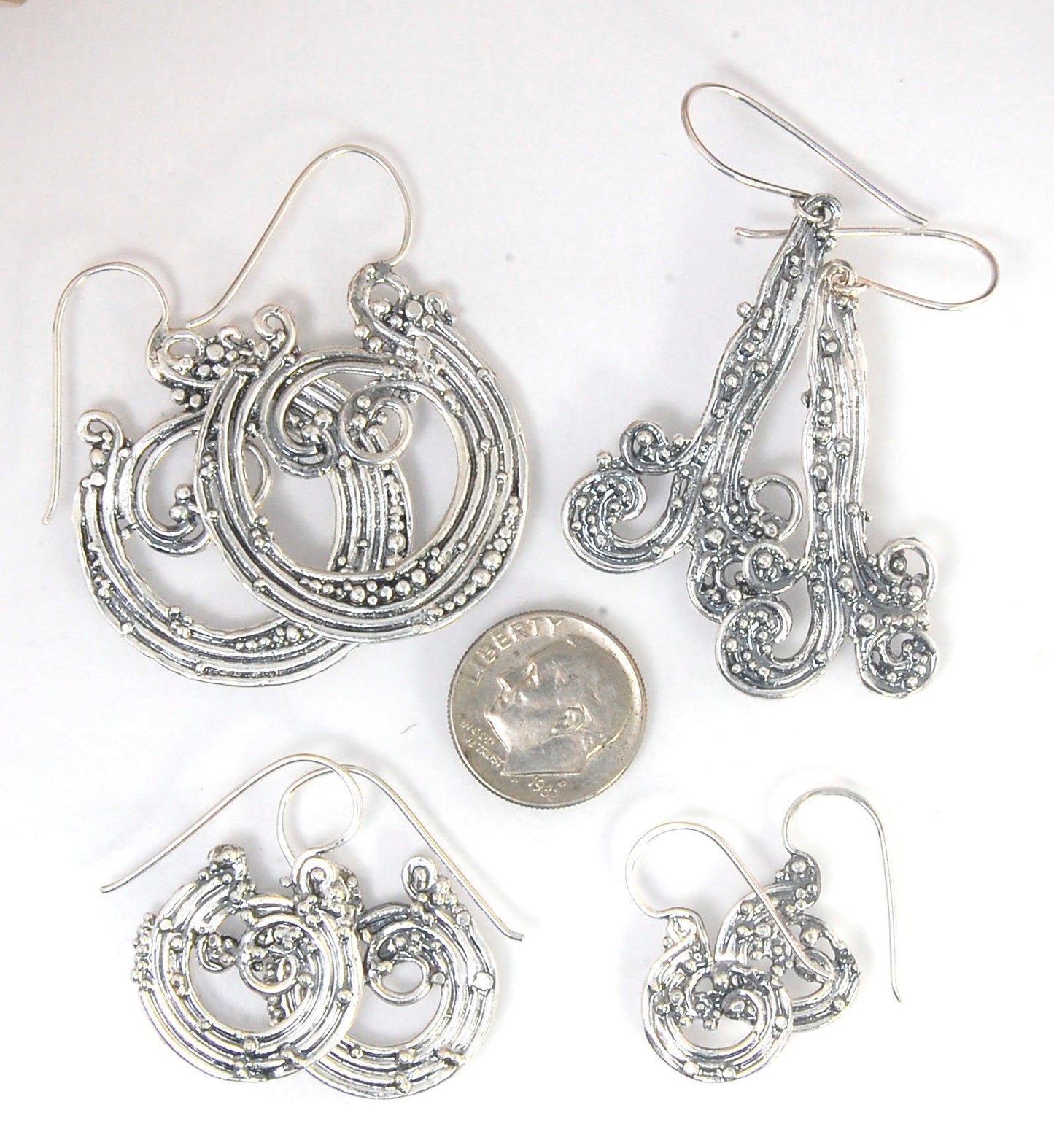 Wave Hoops - Sterling - Medium These Medium Wave Hoops are part of The Minoan Collection. These great Wave Hoops are cast versions of original fine silver granulation work, which is then molded for repeat waxes and then cast in my studio. Granulation is a