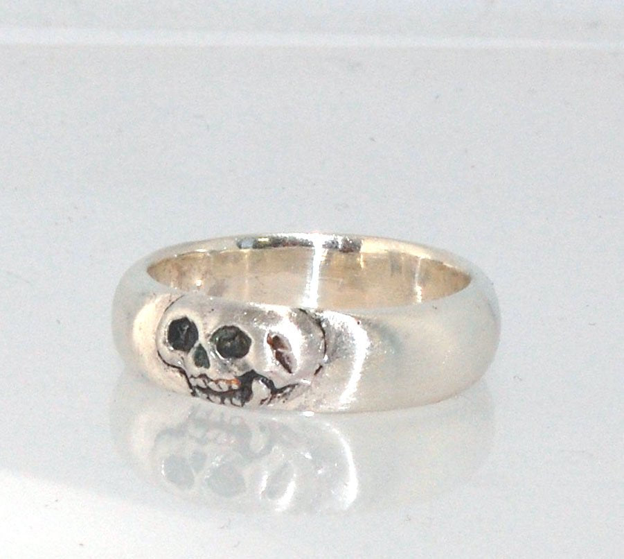 Memento Mori Skull Ring - Wide This is the widest of my Memento Mori skull rings at 7mm. Cast in sterling silver and given a brushed finish after oxidizing the recesses of the skull. Heavyweight, very comfortable.SterlingI made these Memento Mori rings fo