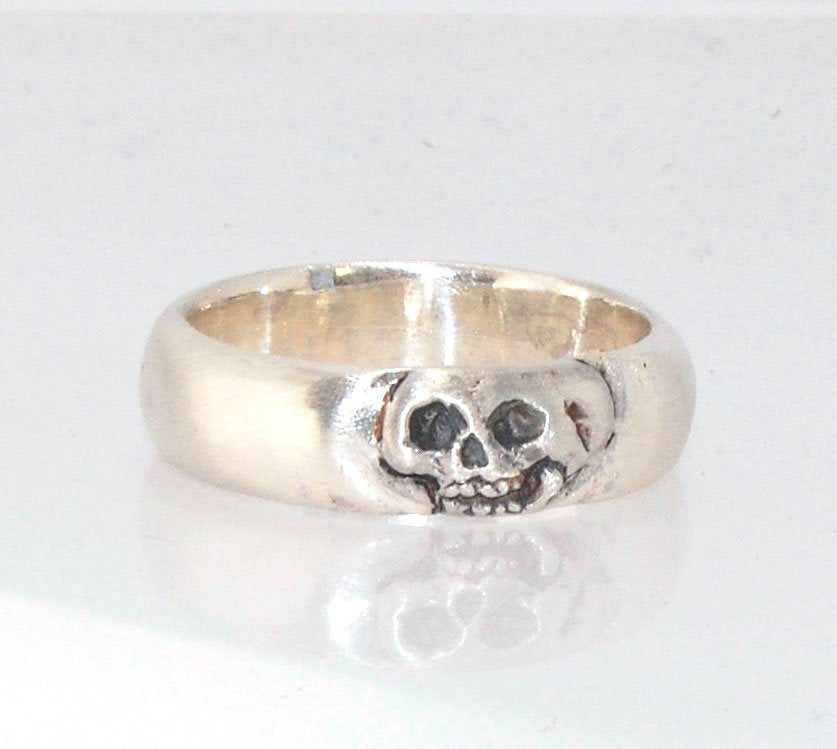 Memento Mori Skull Ring - Wide This is the widest of my Memento Mori skull rings at 7mm. Cast in sterling silver and given a brushed finish after oxidizing the recesses of the skull. Heavyweight, very comfortable.SterlingI made these Memento Mori rings fo