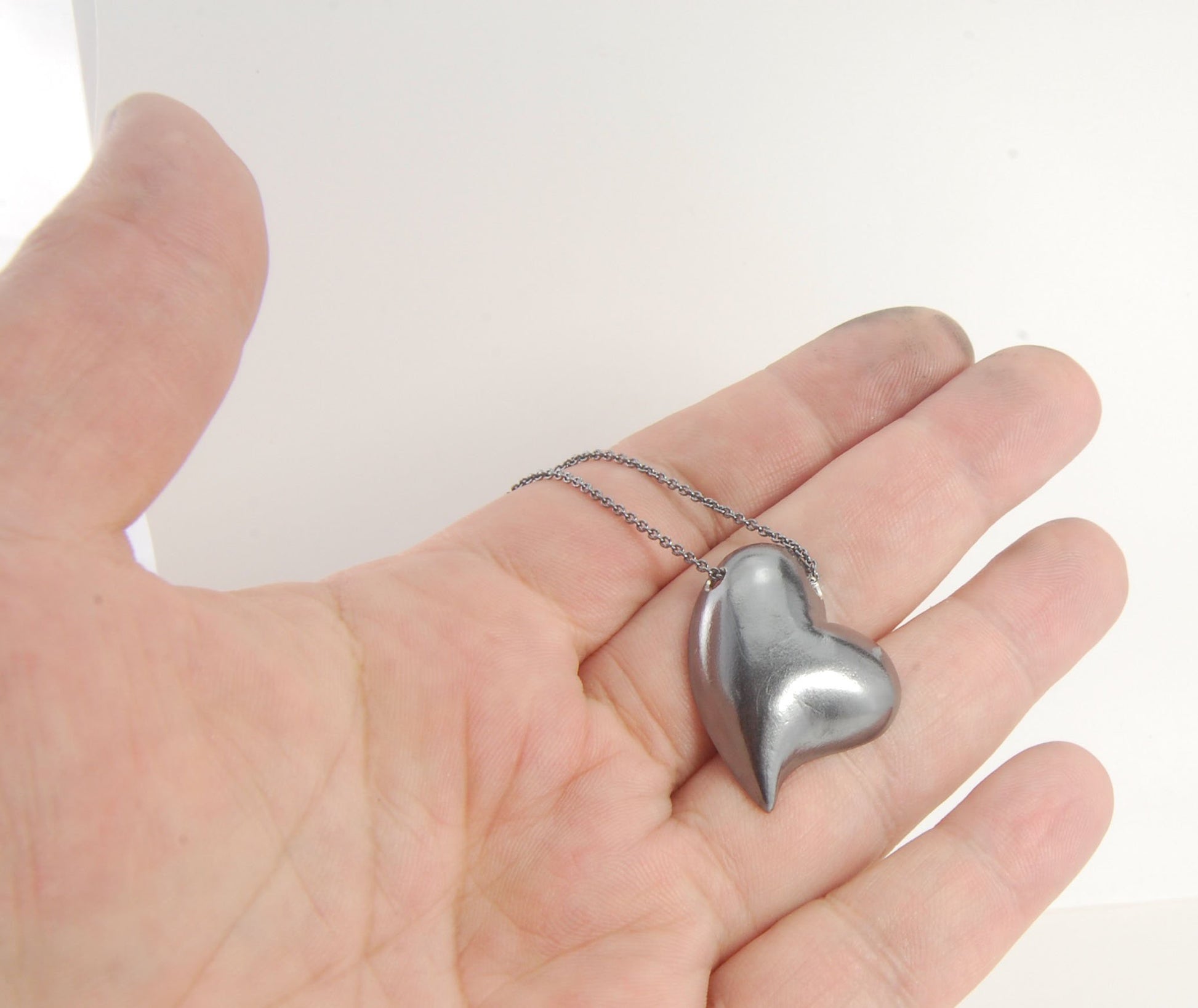 Witch Heart Slider Pendant Necklace This Witch Heart Slider Pendant Necklace in Sterling Silver is a heavy, hollow, silver form I made by wax carving and casting this pendant.The heart shape is called a Witch Heart. Over time, Witch Hearts have symbolized