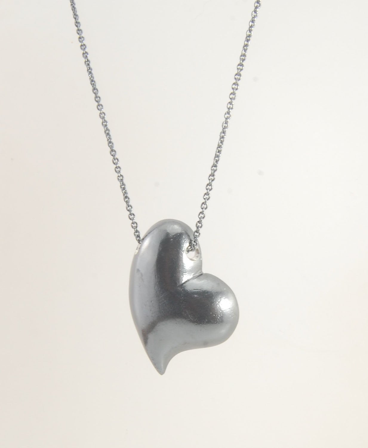 Witch Heart Slider Pendant Necklace This Witch Heart Slider Pendant Necklace in Sterling Silver is a heavy, hollow, silver form I made by wax carving and casting this pendant.The heart shape is called a Witch Heart. Over time, Witch Hearts have symbolized