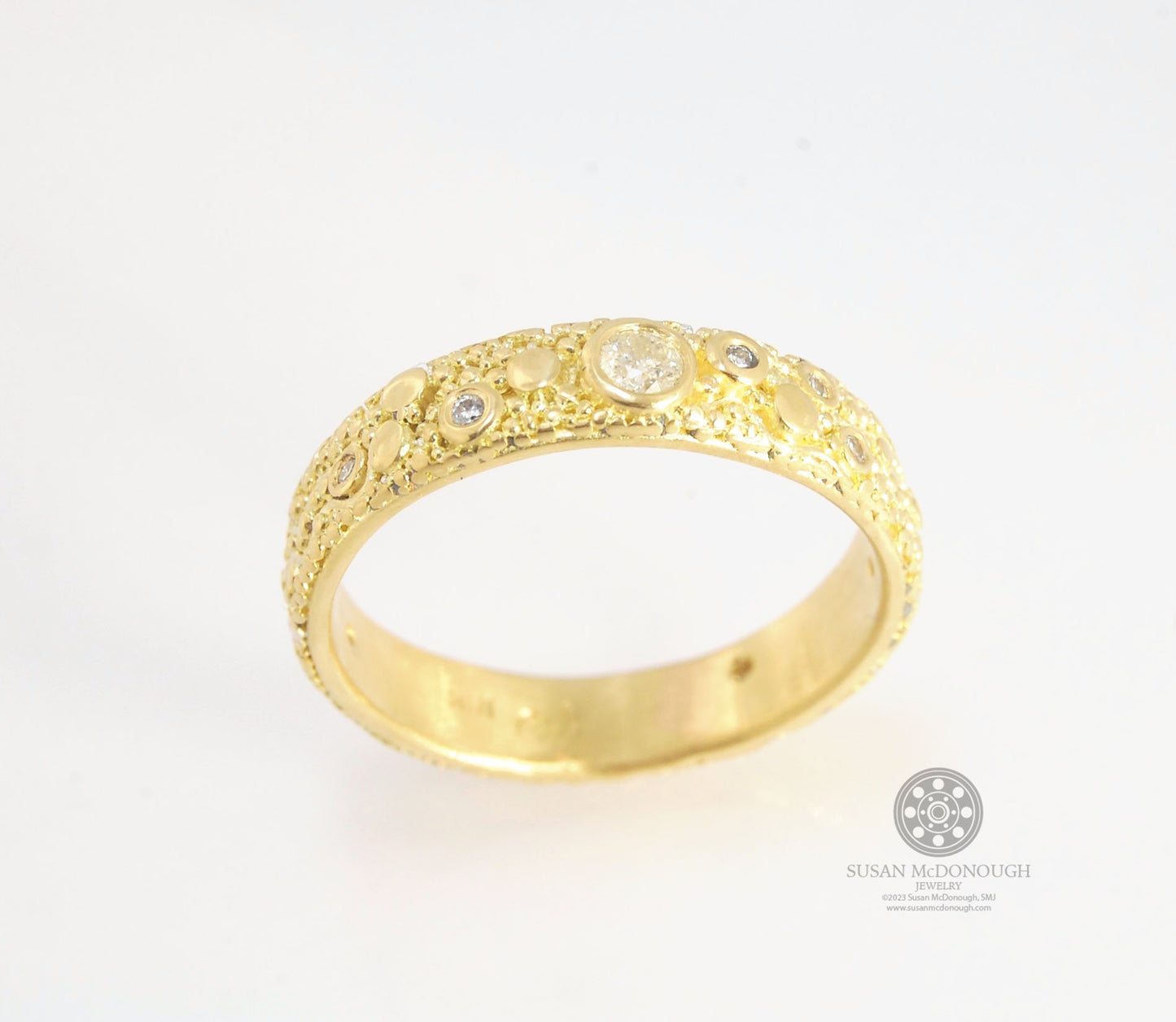 Balance and Flow Band 18k Granulation with 9 Diamonds - Made to Order This is a one-of-a-kind 18k gold and Diamond band made special just for you! The pattern is a balance of twining lines and granules and slices of cylinder ingots to make settings for ni